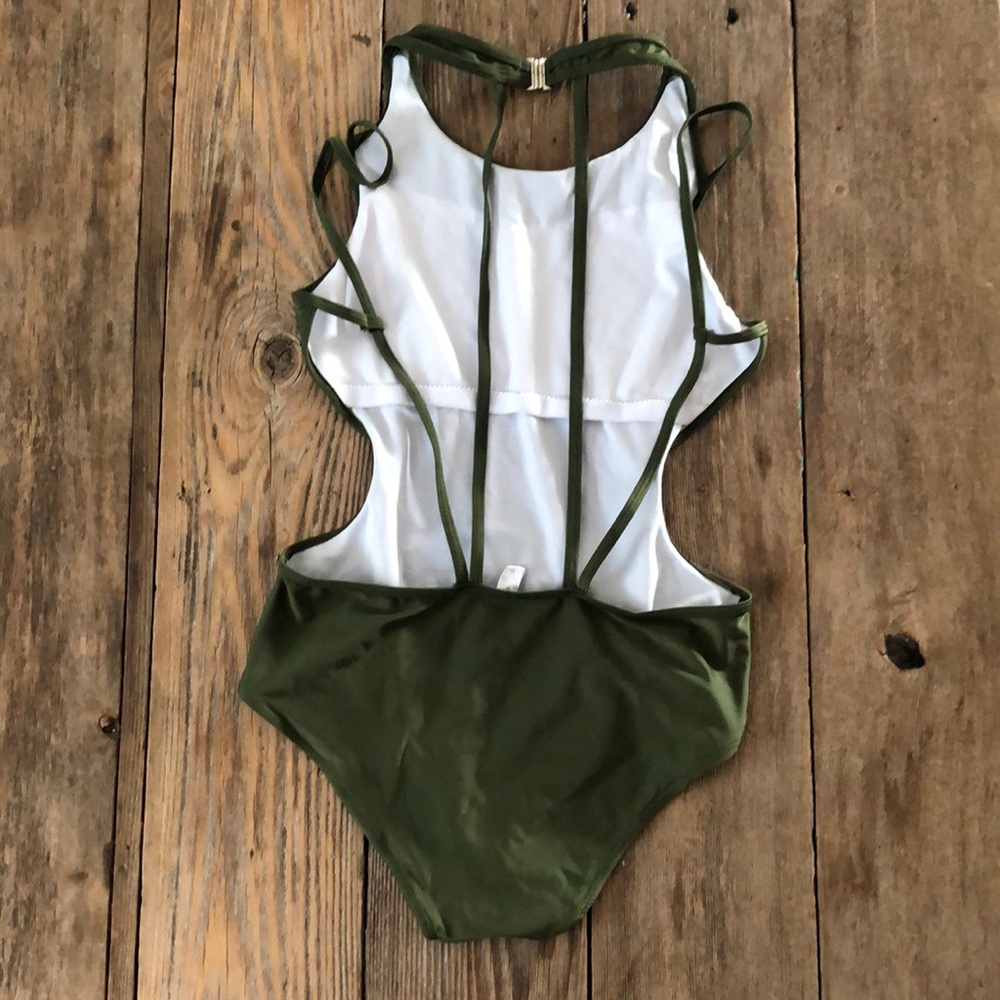 No tag bought at Dillards super cute cutout one piece swim suit size Medium